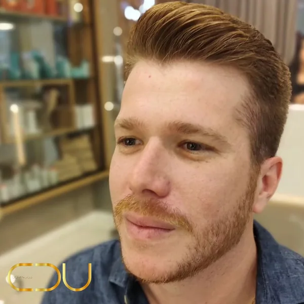 Corte masculino com barba alinhada
